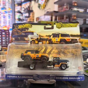 Transport que incluye un Toyota FJ Cruiser naranja y un camión Horizon Hauler